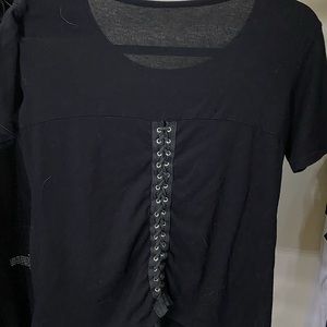 Black shirt with a custom be nice patch